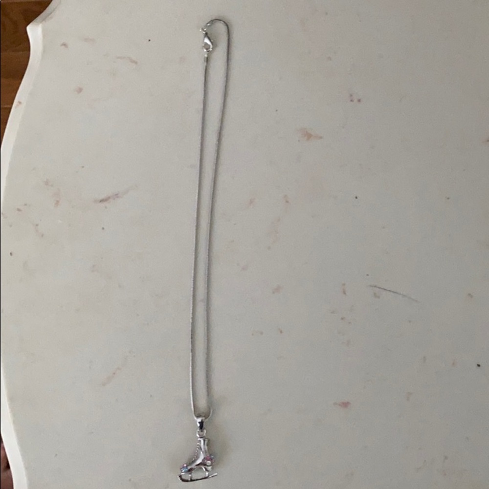 Silver ice skate with gems necklace